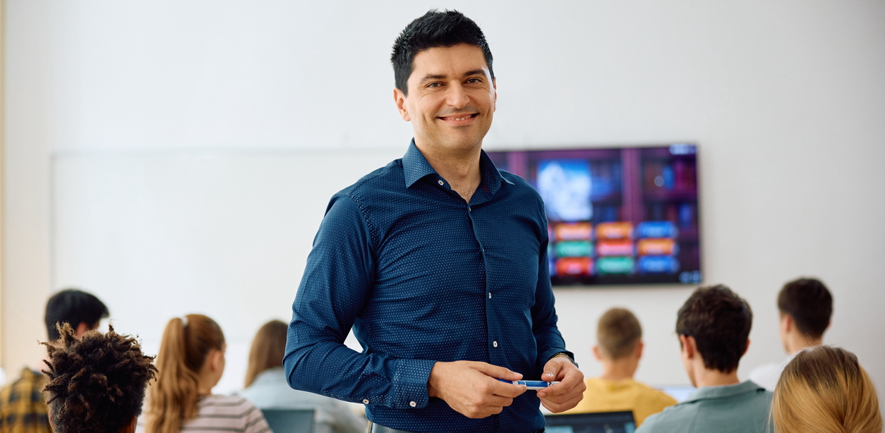 istock photo / teacher in classroom with students